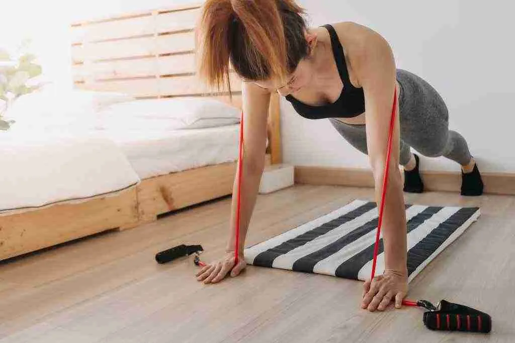 Push ups using a resistance band for chest exercises in our hotel room workout