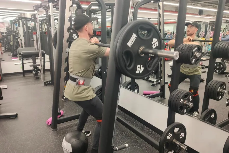 Lee squatting at Firehouse Gym NJ - one of the best bodybuilding gyms in the state